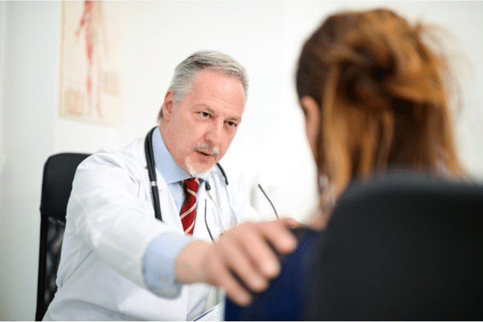 I lived through my death, plot is that woman is told has only months to live, image of doctor talking somberly to young woman